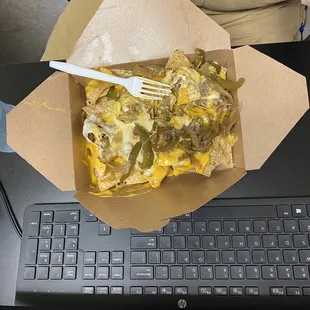 a box of food with a fork in it