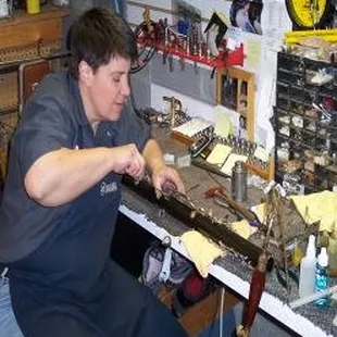 Repair Shop Foreman Karen Gleason has over 40 years of experience in wind instrument repair.