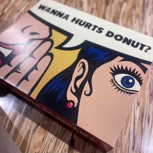 a close up of a box of donuts