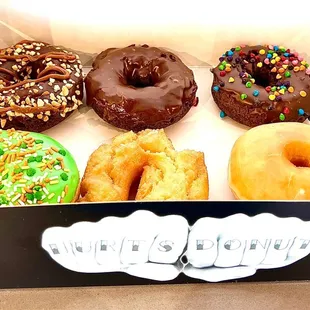 a variety of donuts in a box