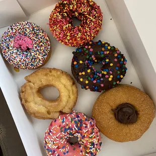 Homer, old fashioned glazed, animal cookie, chocolate sprinkles, cosmic brownie, and Nutella cinnamon