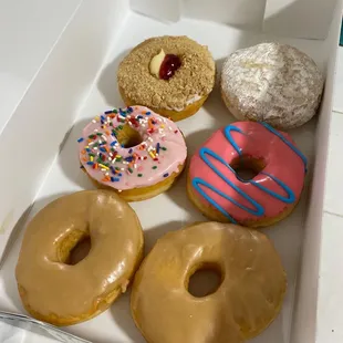 a variety of donuts in a box