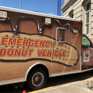 an emergency donut vehicle parked in front of a building