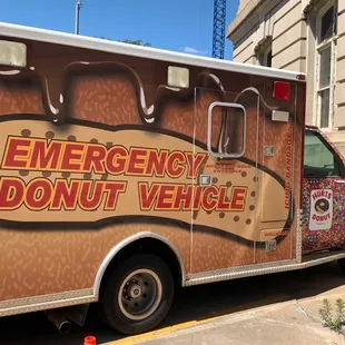 an emergency donut vehicle parked in front of a building