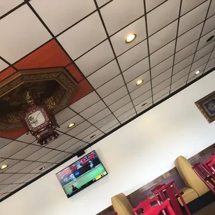 a clock on the ceiling of a restaurant