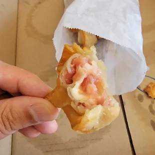Uncooked pork meat in their Fried Wonton