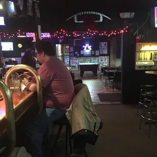 a woman sitting at a bar