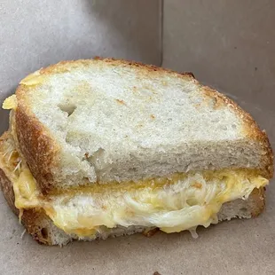 Half of the grilled cheese sandwich