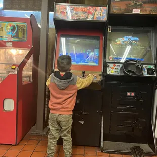 a young boy playing a video game