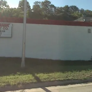 a white building with a red roof