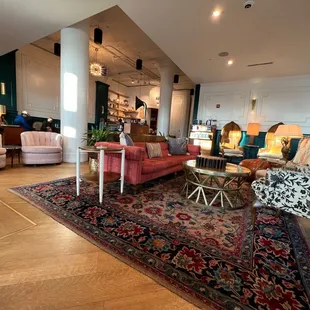 a living room with a large rug