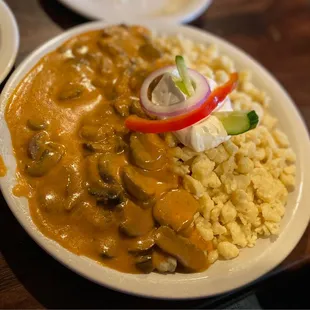 a plate of food with rice and vegetables