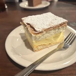 a piece of cake on a plate with a fork