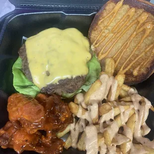 a hamburger, fries, and a sandwich