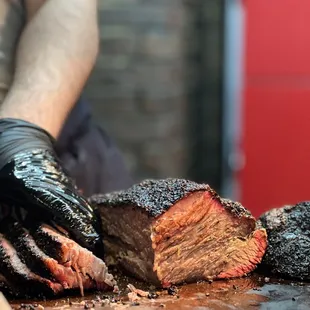 a man cutting a piece of meat