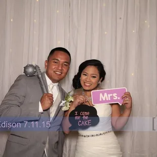 Flash a Smile Photo booth at Hutchins Street Square for wedding reception flashasmile.com Bride &amp; Groom having fun in open photobooth