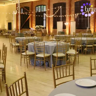 Soft Gold Uplighting by Brighten Up Lighting in the Kirst Hall at Hutchins Street Square.