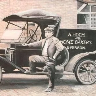 a man sitting in an old car