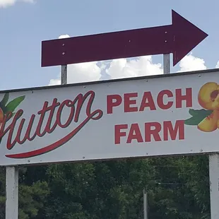a sign for a peach farm