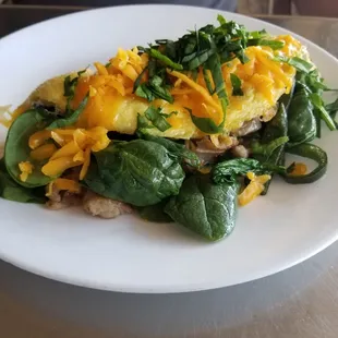 Cheese omelet with poblanos, sausage &amp; spinach added.