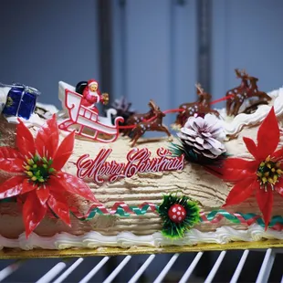 a christmas cake decorated with a sleigh