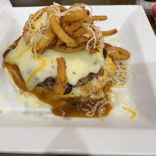 Rat Rod (burger patty, cheese, onion strings) on top of mashed potatoes and gravy.