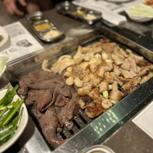 a variety of food on a grill