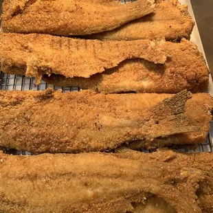 a close up of fish on a rack