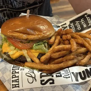 Bacon burger with fries.