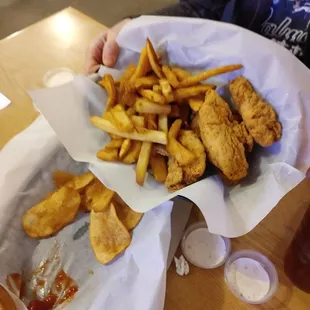 a basket of fried chicken and fries
