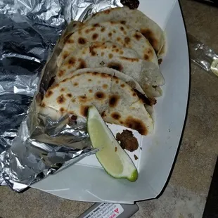 You can see how tiny the tacos are next to the  slice of lime