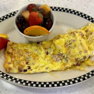 Green Country Cast Iron Skillet | Three Scrambled Eggs, Bacon, Sausage and Ham, Cheddar Cheese and Fruit Salad
