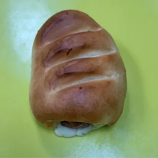 a bun on a yellow plate