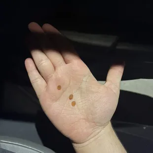 a person's hand with a dot on it