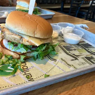 Grilled chicken burger with lettuce, tomato, and pepper jack chees. Ranch dressing on the side. Yum!