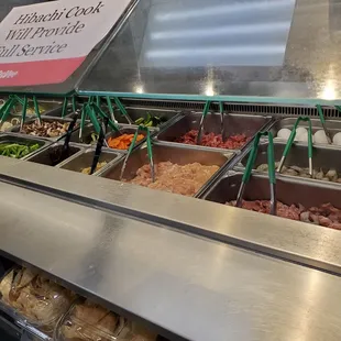 Hibachi area with meat and veggie selections. They give you 8oz of protein - chicken, beef, shrimp, eggs and maybe pork