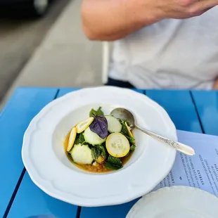 a plate of food on a blue table