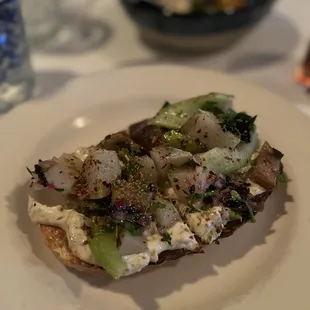Crostini of sunchokes and tonnato with pickled eggplant, and celery on house made semolina bread