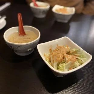 two bowls of food on a table