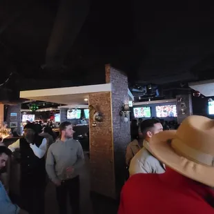 Large dining area with lots of TVs