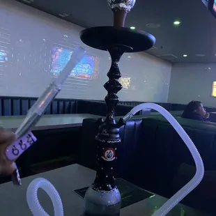 a hookah with a glass on top