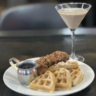 a plate of waffles and a martini