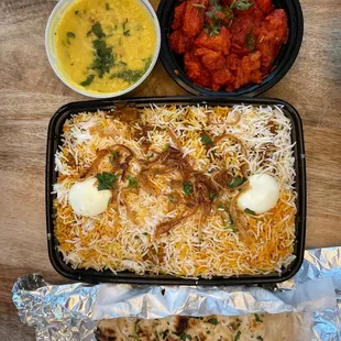 Boneless chicken biryani and chicken 65 family pack, with garlic naan and dal tadka