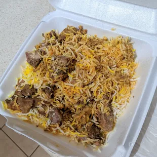 The goat dum biryani was a lot in a to-go box.