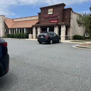 a car parked in front of a restaurant