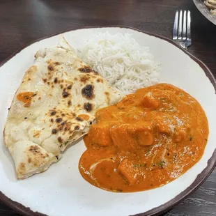 My plate - butter chicken, butter naan bread, basmati rice.