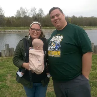 a man and woman with a baby