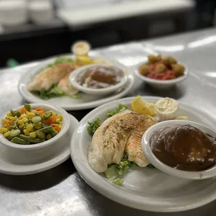 three plates of food on a table