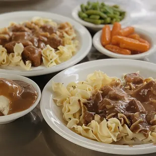 three plates of food on a table