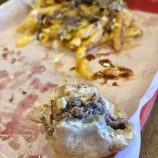 a hamburger and fries on a tray
